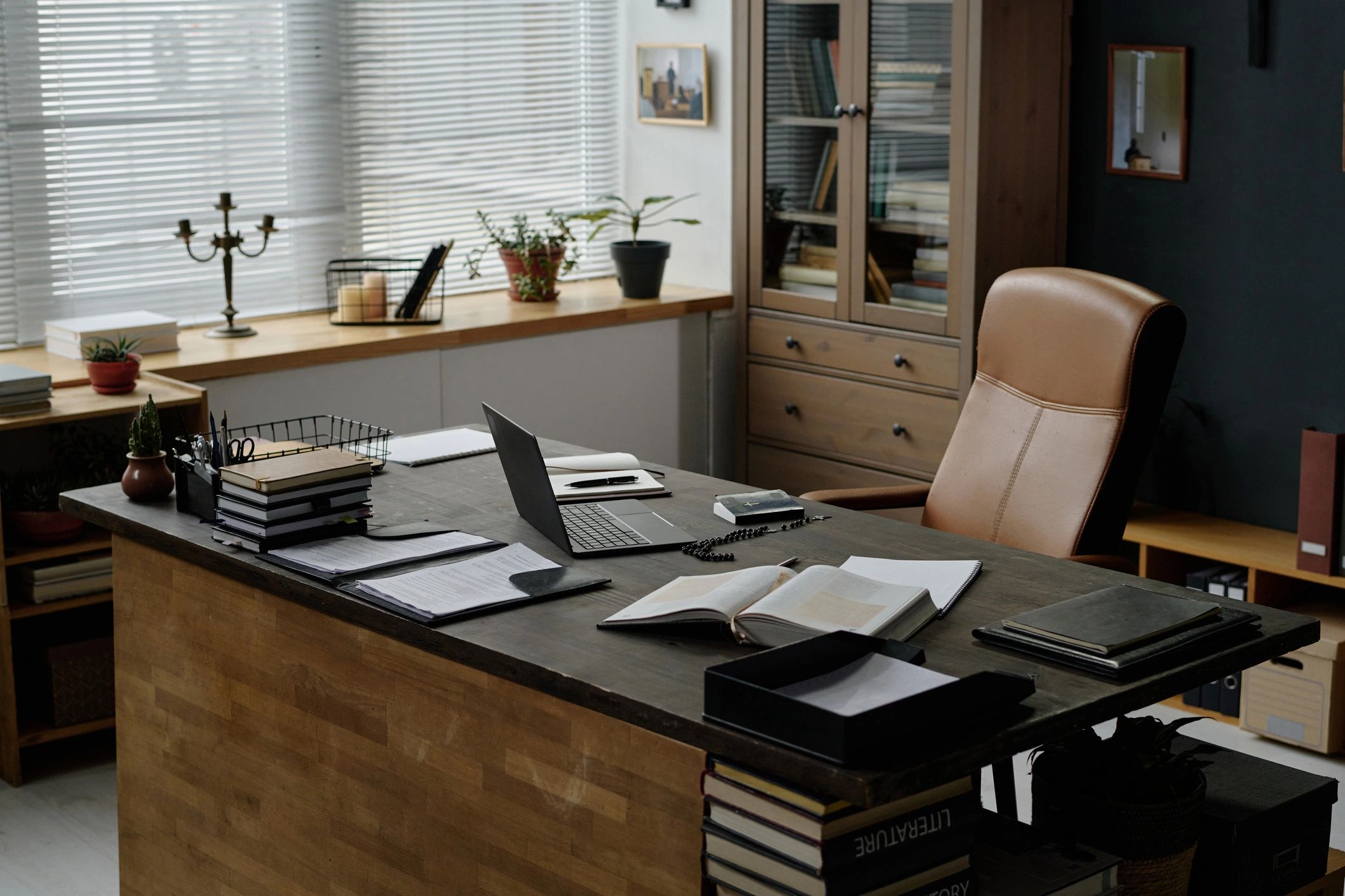 Wooden desk with laptop in a professional workspace
